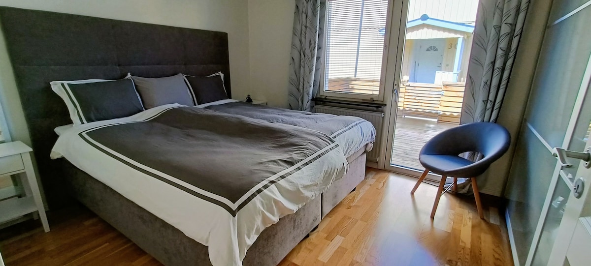 Bedroom downstairs (new bed) with attached patio.