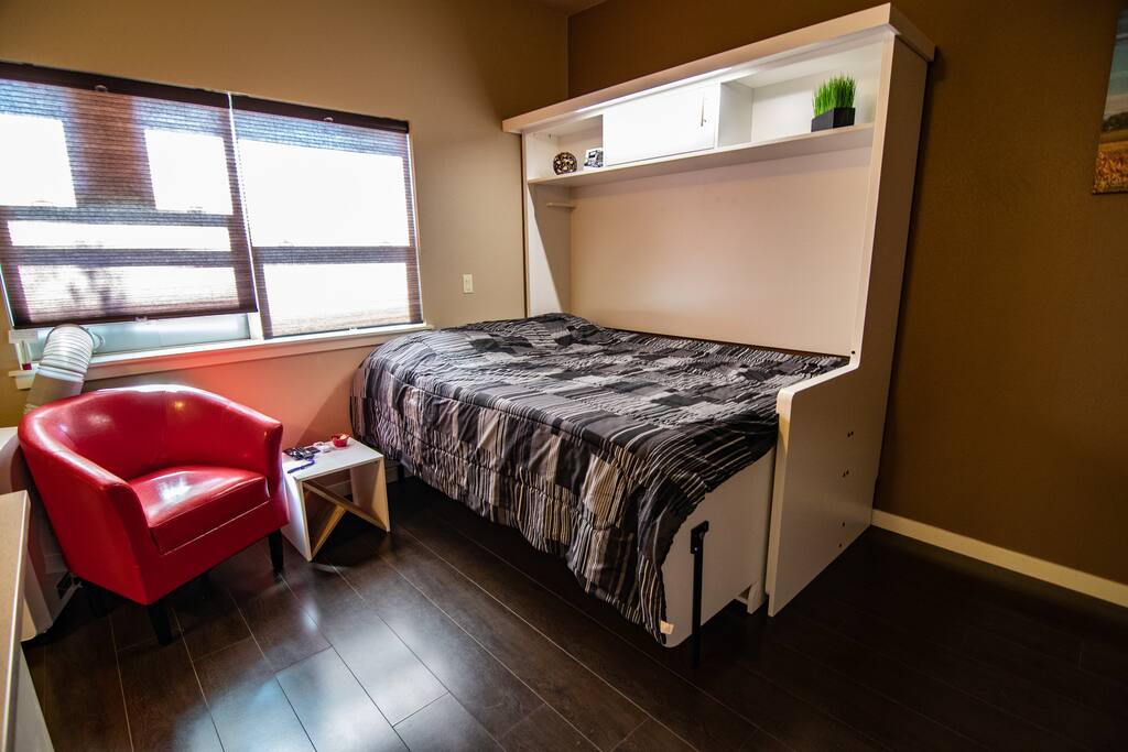 Brand new queen size murphy bed with lighting for extra comfort and space.