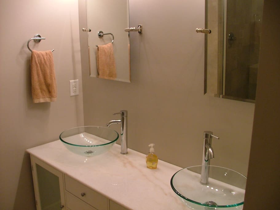 Hugh bathrooms with double sinks and massive 30sf showers with bench seating