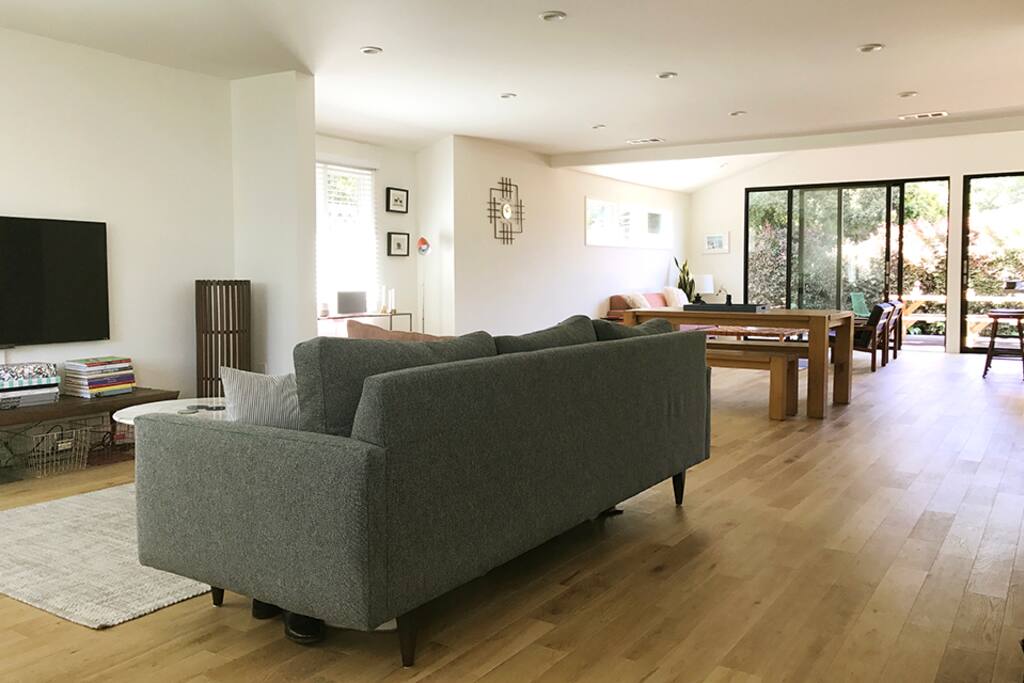 As soon as you walk into the house, you'll find an open space with a partial vaulted ceiling.
