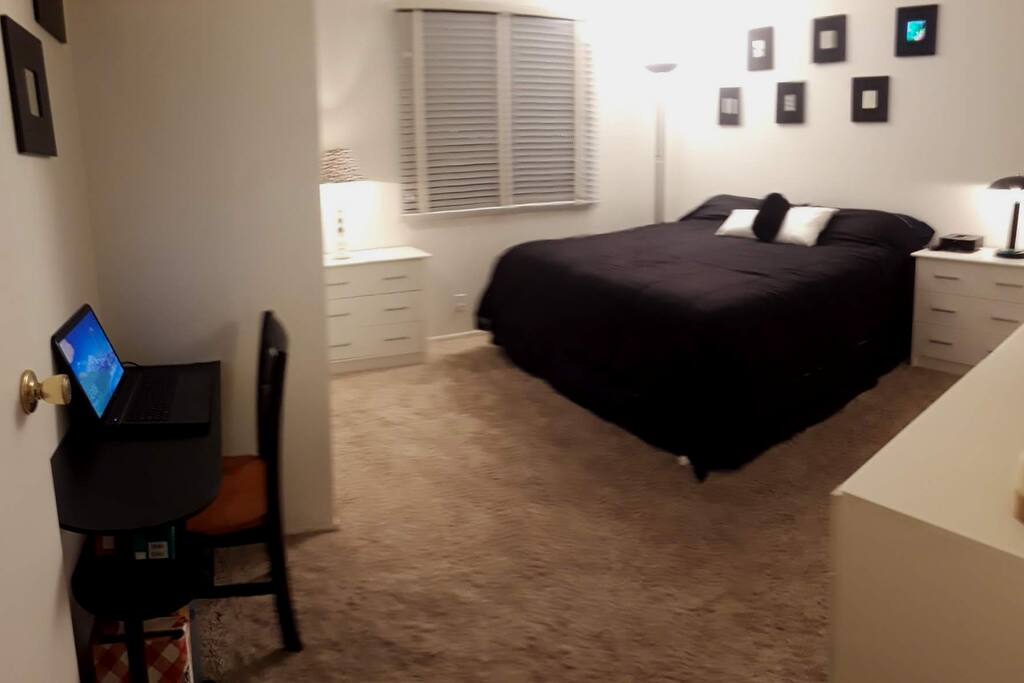 Master Bedroom (King Bed with 40" smart TV) with view of private back yard