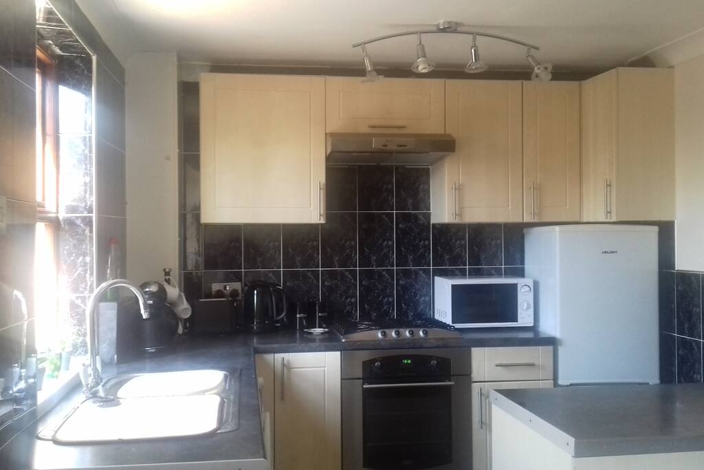 kitchen area with use of washing machine.