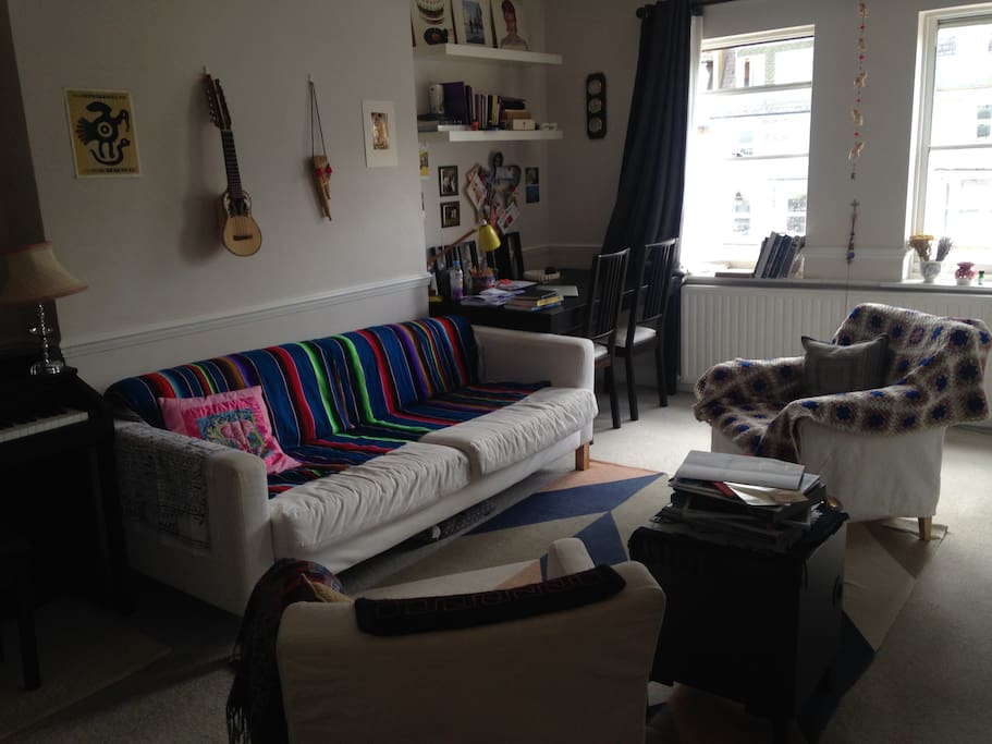 Cosy living room with lots of great wall art