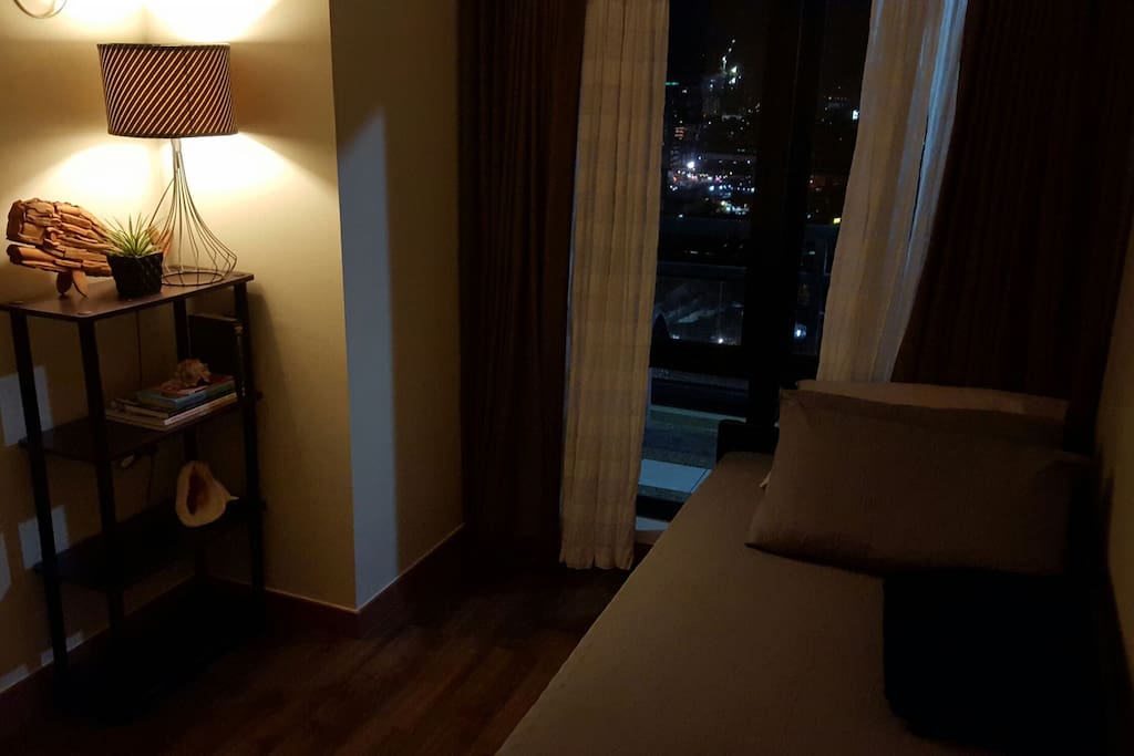 Double curtains for blocking out sunlight during daytime sleeping.