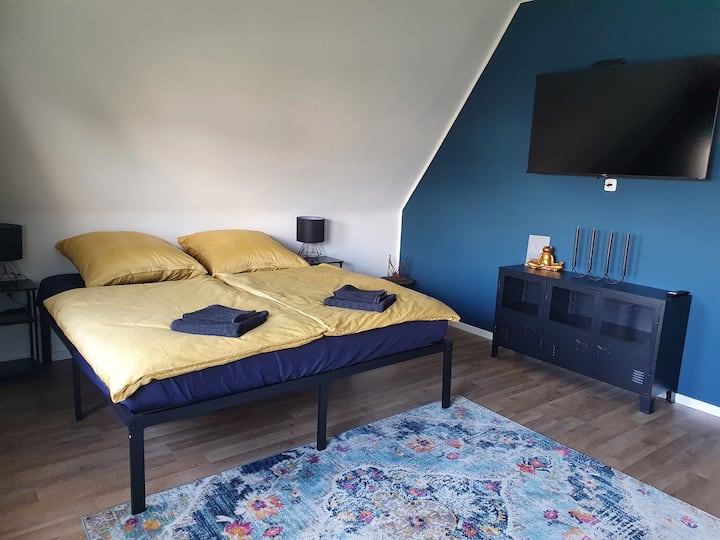 Habitación 1 con TV inteligente de 55 pulgadas