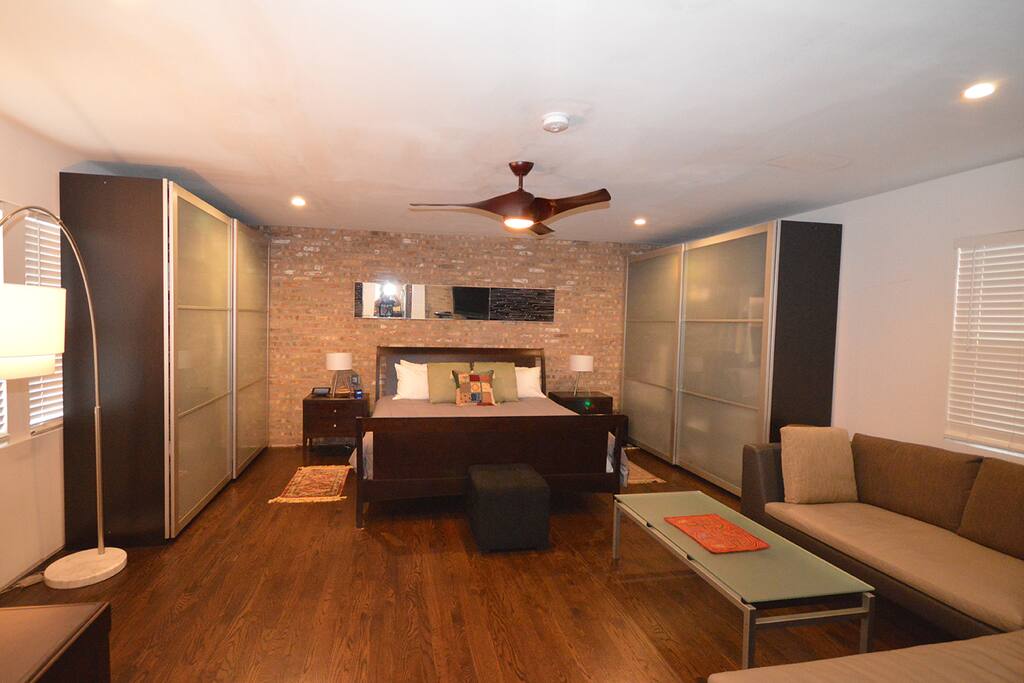 Large Master Bedroom with King Bed and Lounge Area.