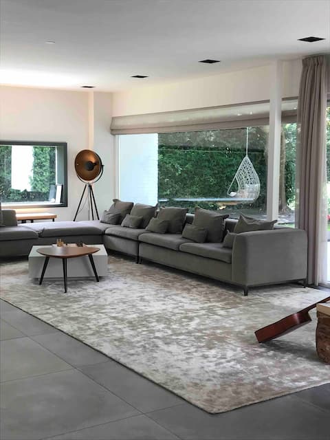 House with garden and tranquil waterway view