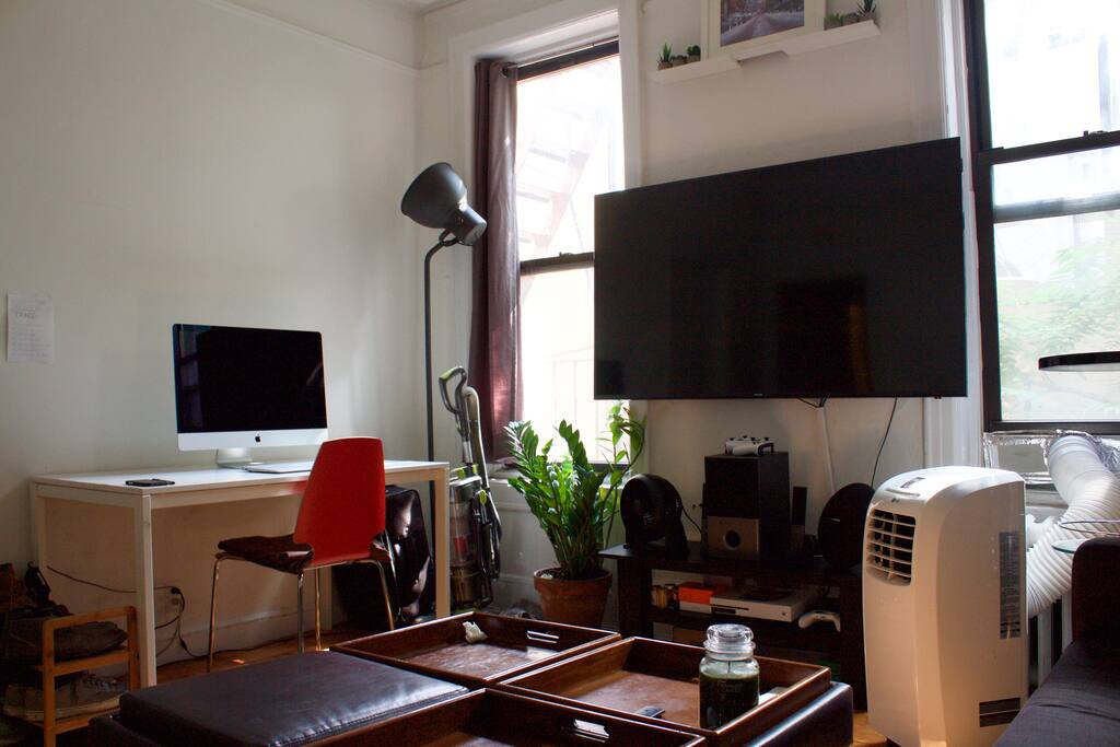 Another view of living room. Air conditioner is stored away during winter!