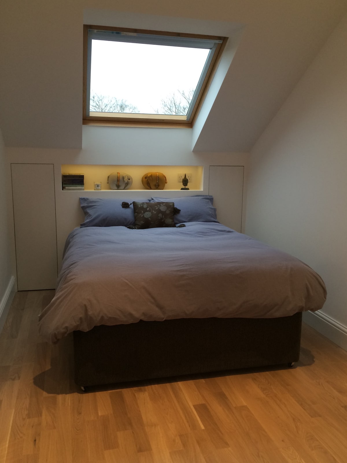 Double bed with storage in the eaves behind, plus drawers under the bed