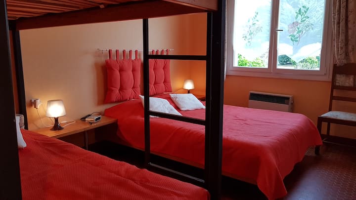 Bedroom sleeps 4 including 1 queen bed and 2 bunk beds