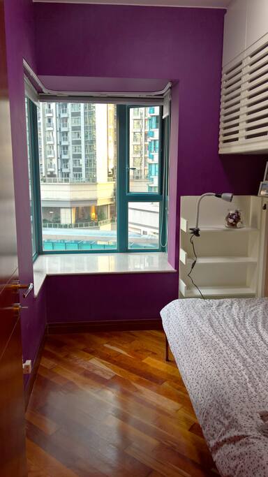 Private single bedroom with air con, spacious room area and shelf space for travel belongings