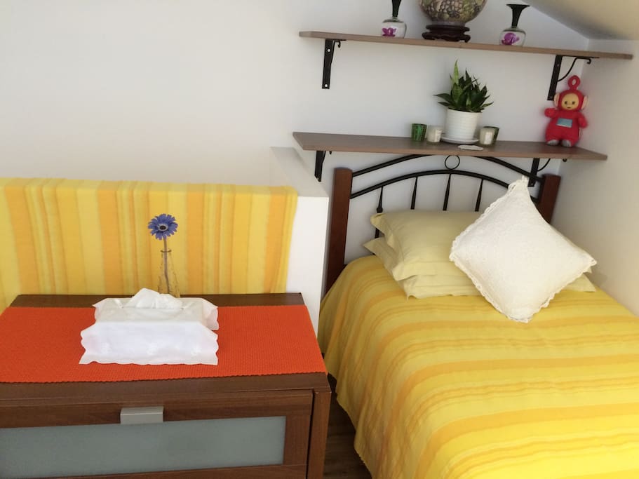 Single bed and the chest of drawers