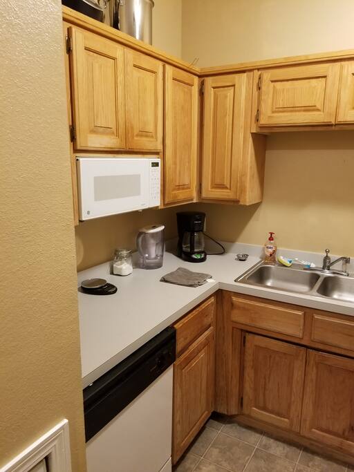 Kitchen with coffee pot and dishwasher