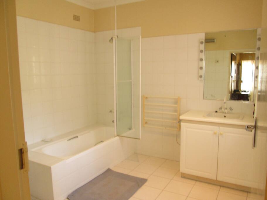 The en suit bathroom with shower unit