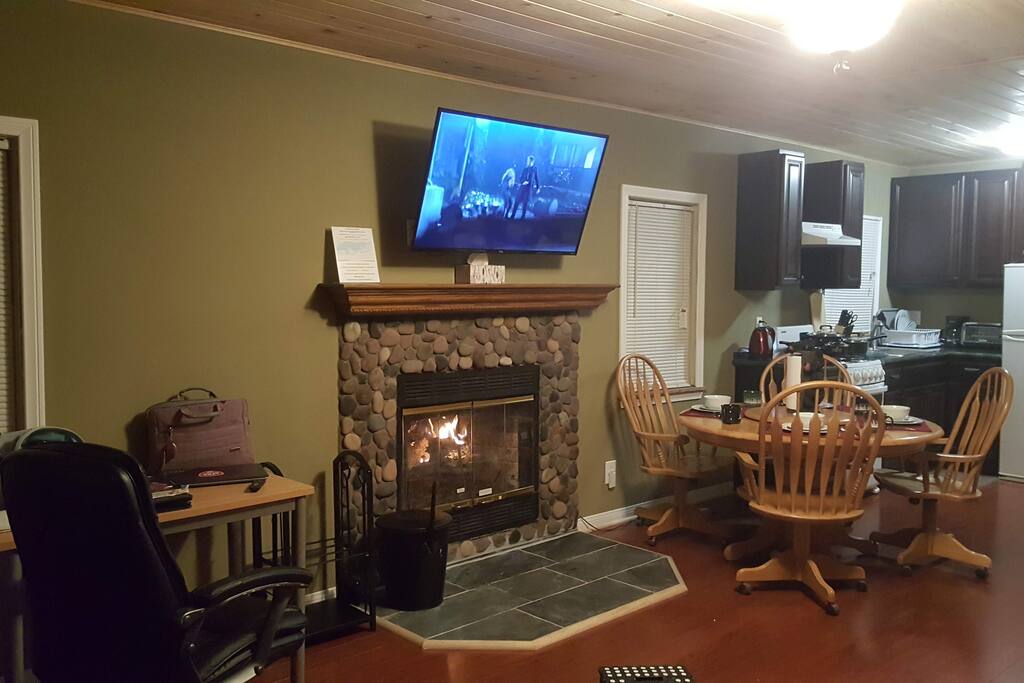 Welcoming Fireplace and 49 inch TV