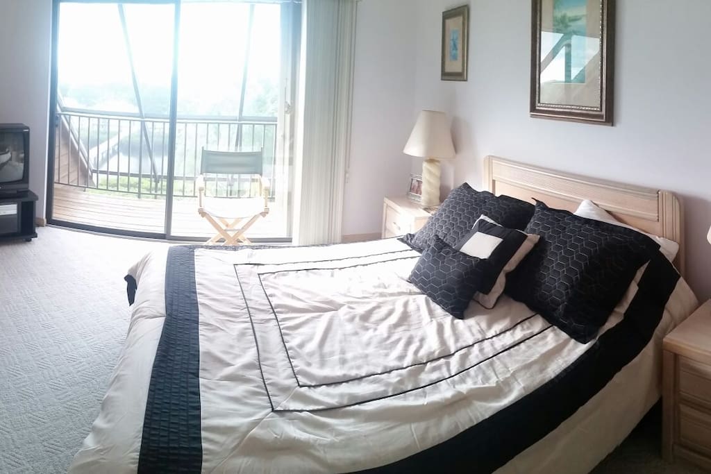 Large room with a large screened in deck overlooking the back bay! Best sunrise view in the home!