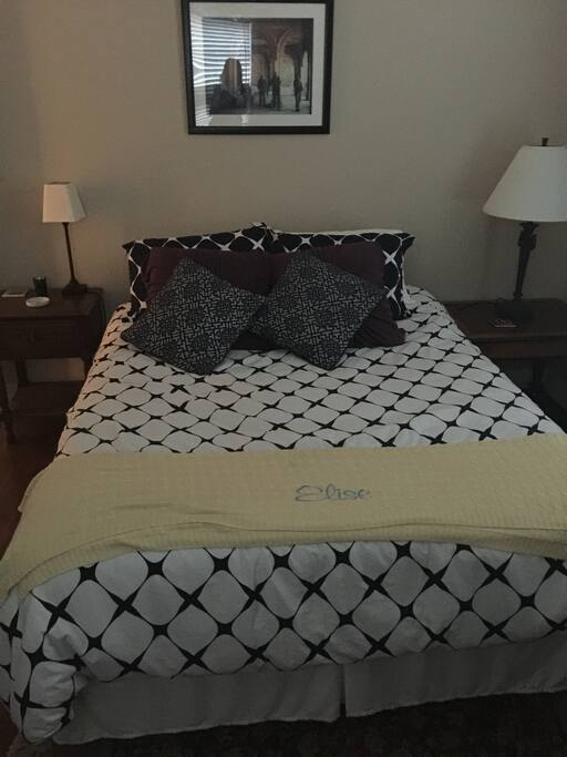 Queen bed in guest bedroom