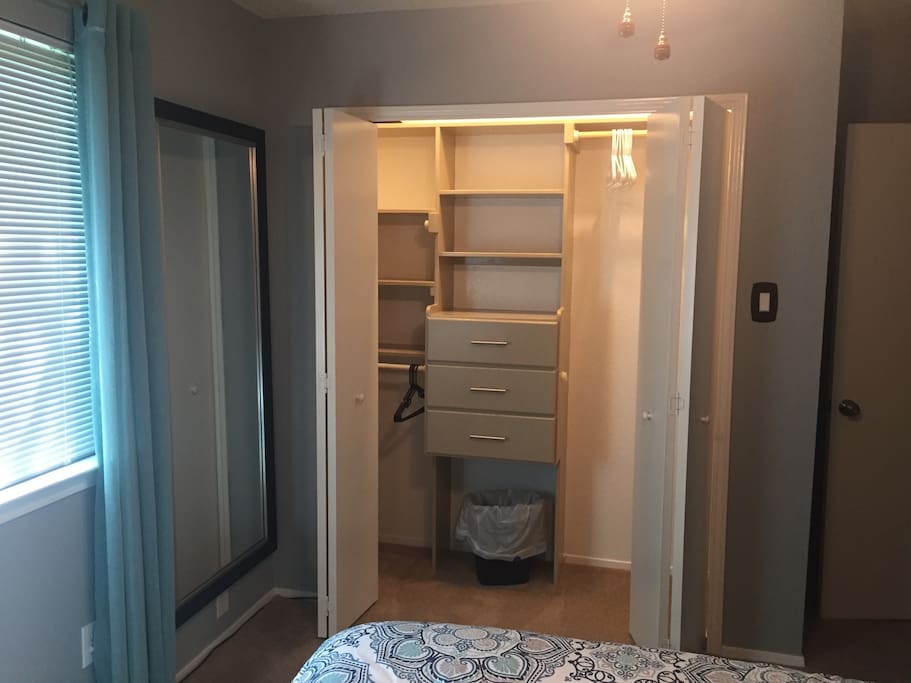 Huge closet with plenty of hanging, drawer, and shelf space! Full length mirror to ensure you look your best before hitting the town.