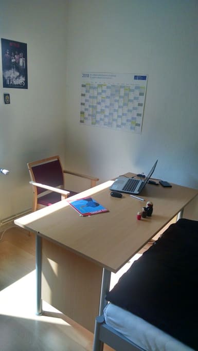 The desk, with a comfortable chair