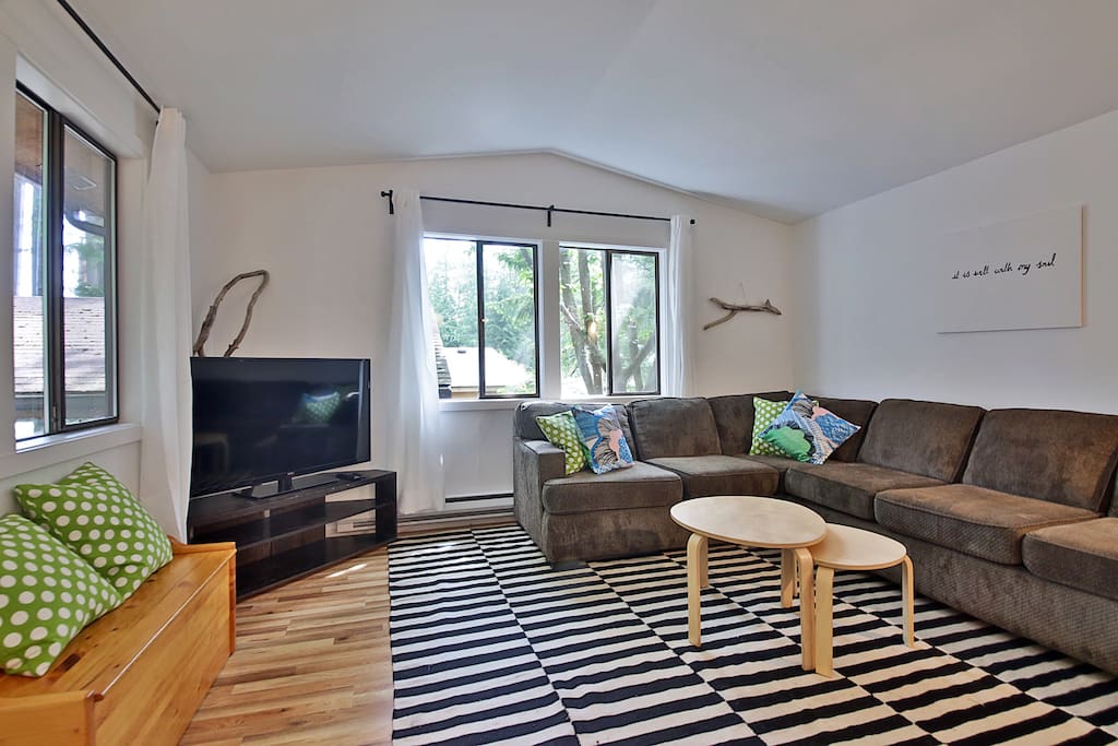 Cozy up on the couch and have movie night on the large flat-screen TV.