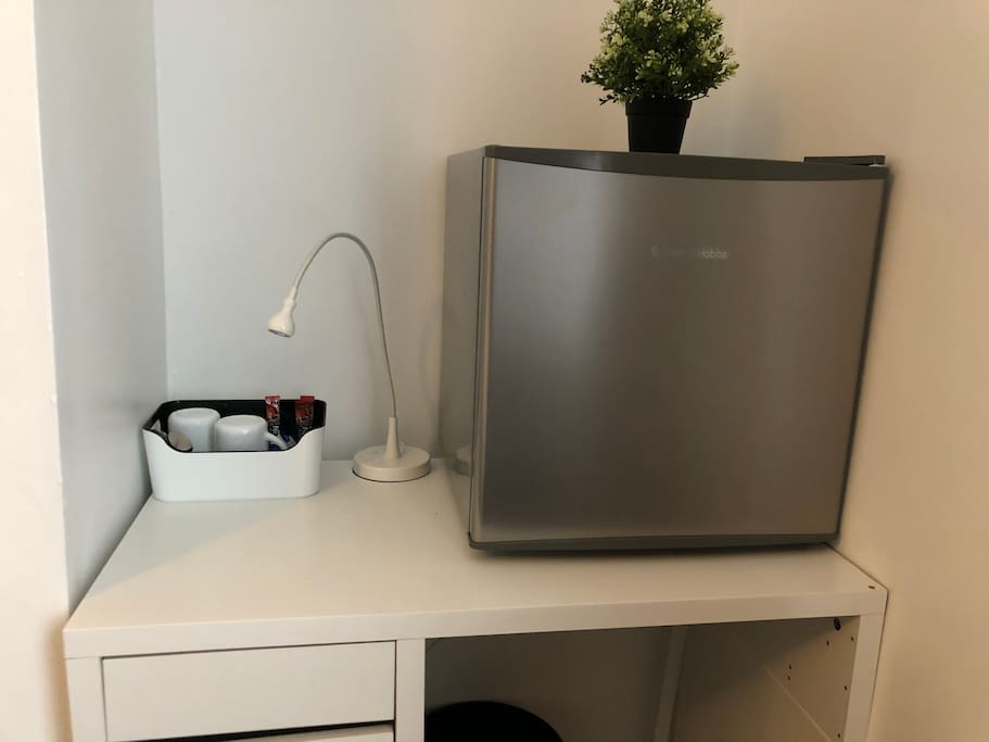 Desk, tea/coffee and fridge facilities in room