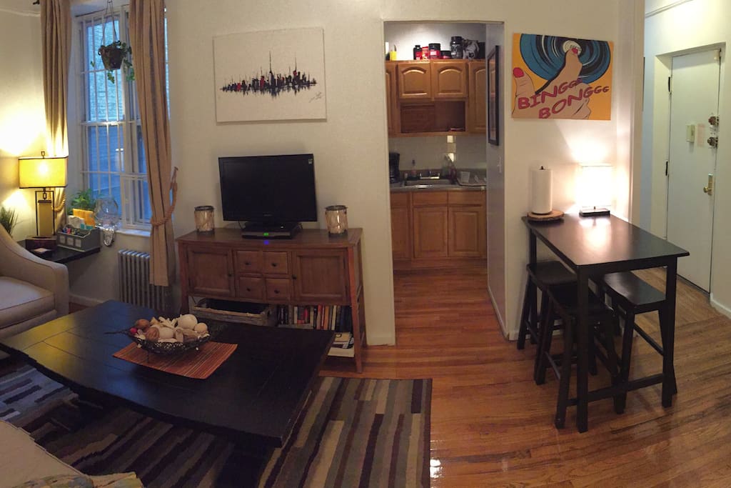 Common area and bistro table with view towards kitchen