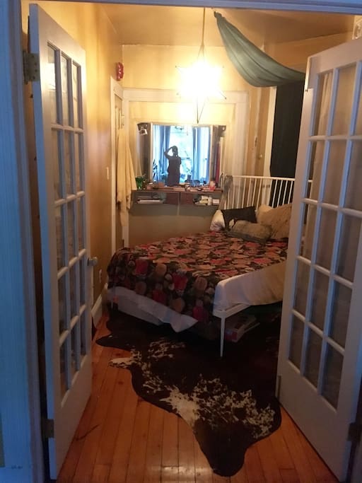 The bedroom. It's hard to capture this room from any angle. To the right behind the door, is a nice sized closet.