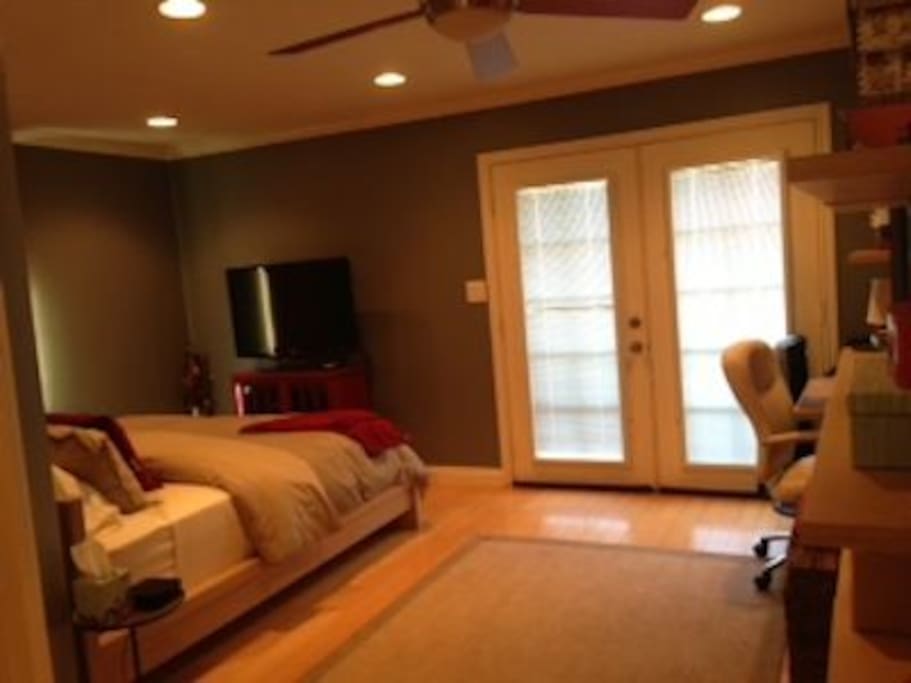 French Doors in master bedroom leading out to back deck and backyard