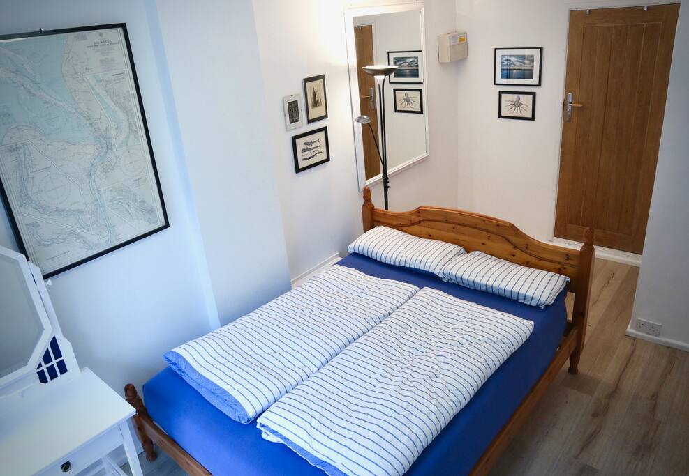 Downstairs - bedroom with double bed and dressing table