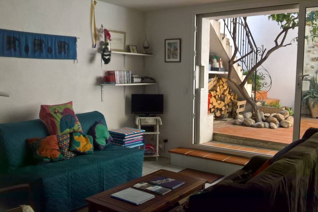 Lounge with tv/audio corner by entrance on to terrace