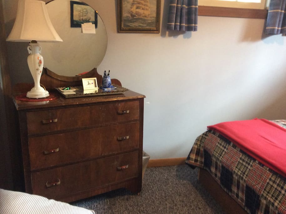 The dresser has two empty drawers if you wish to use them. The room has several mirrors allowing you to dress or groom yourself.