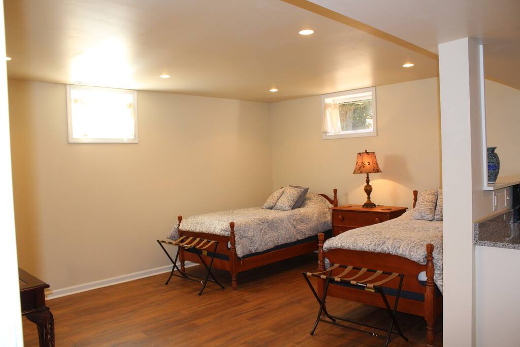 2 twins in living area, queen bed in this bedroom