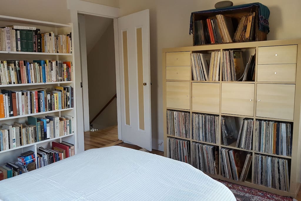 Surrounded by books and record albums.