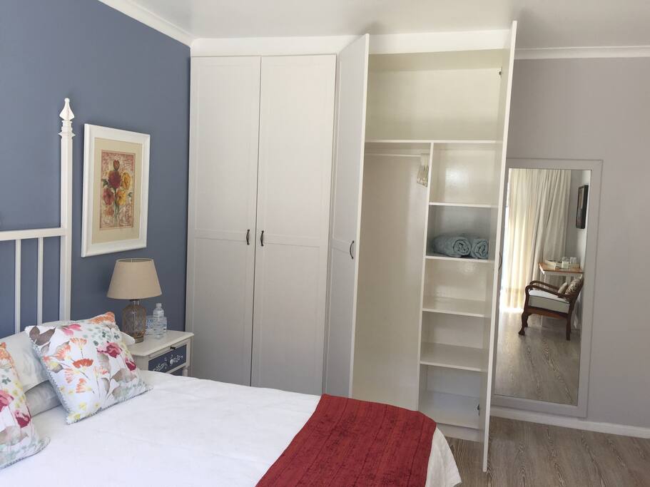 Ample cupboard space and full length mirror