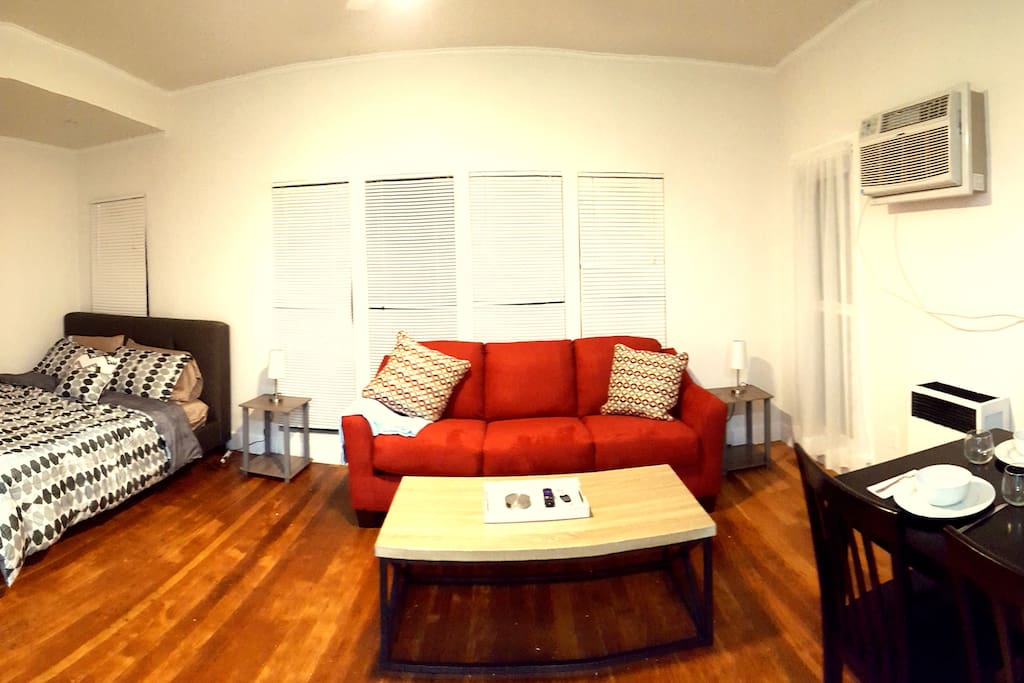 The large living room has a nook with a queen bed (in addition to the private bedroom with a queen bed!)