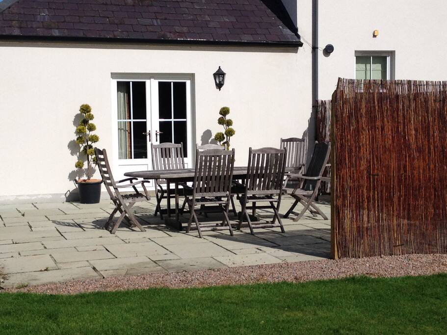 Your patio and barbeue area opens on to a lawn