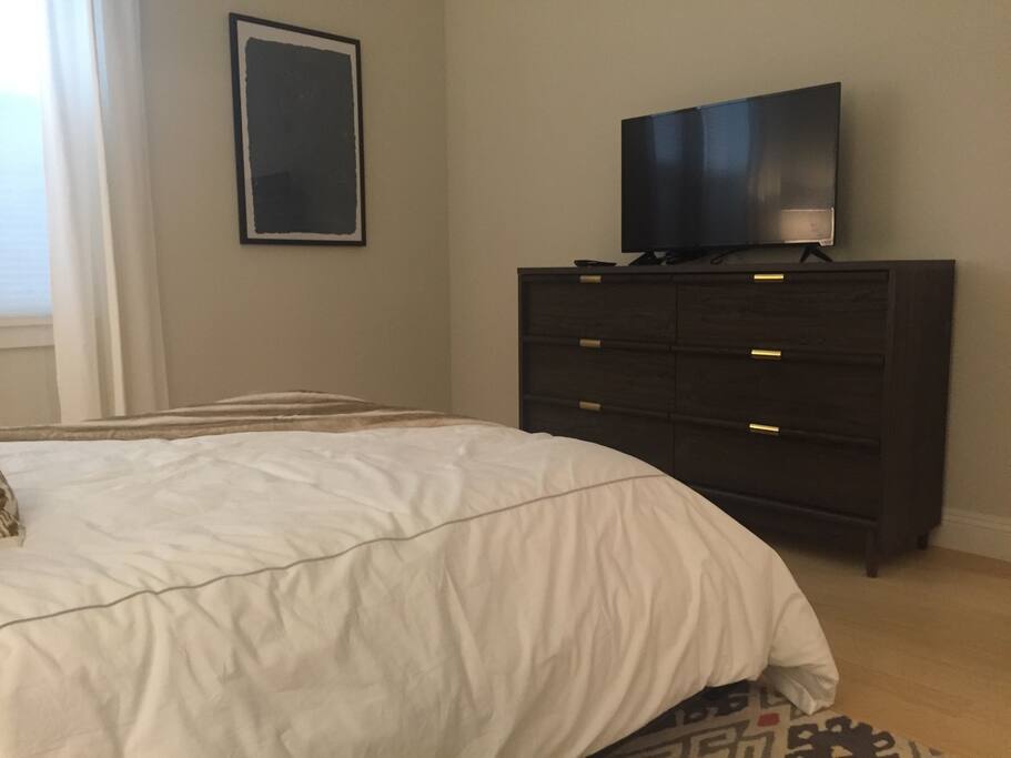 Master bedroom with new queen bed and en suite bathroom