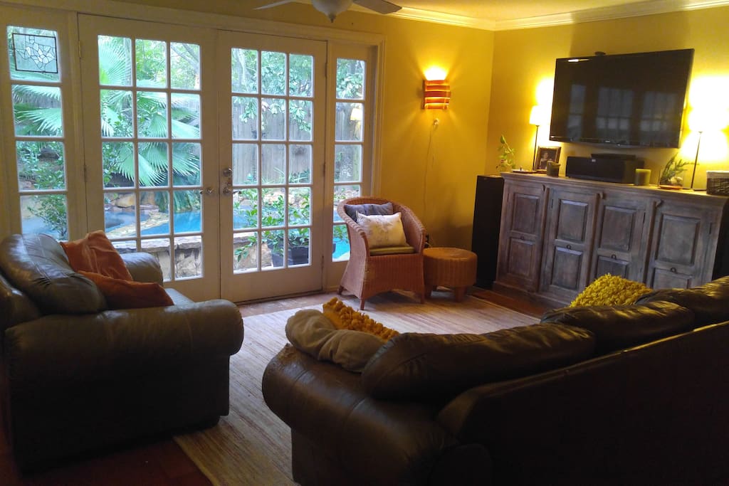 TV room with view of pool/hot tub