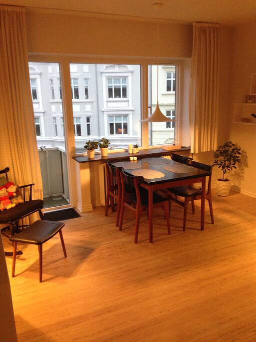 The living room with access to the balcony (sorry for the light!)