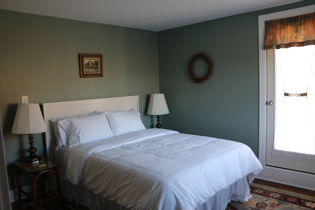 Bedroom with queen size platform bed with memory foam mattress.