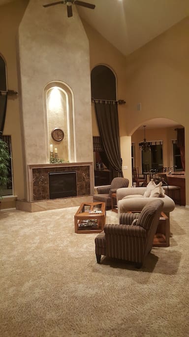 living room with gas fireplace 28 foot cathedral ceilings