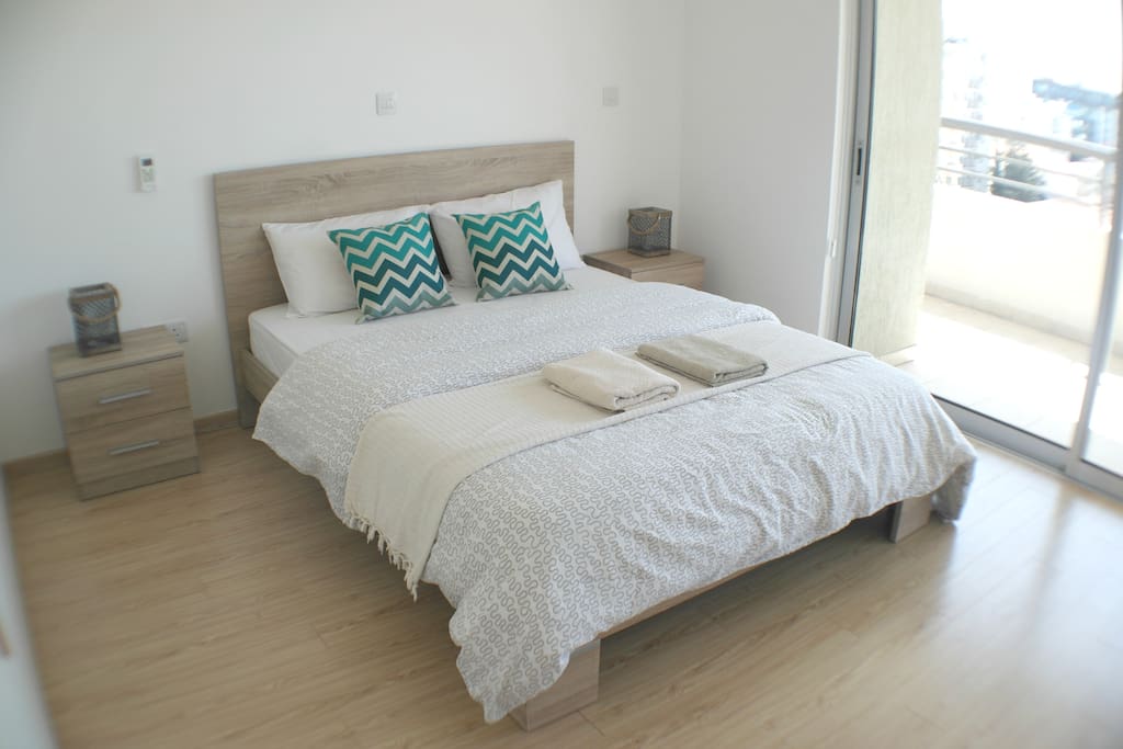 Master bedroom has queen size bed with fresh linen and towels