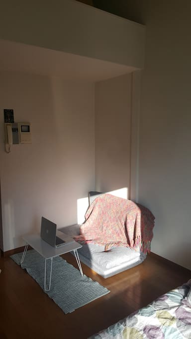 Little couch (can be used as a futon as well) and coffee table to eat or work on your computer.