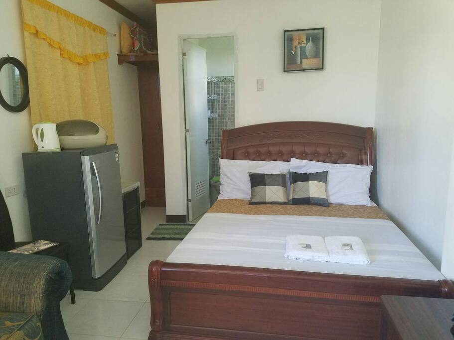 queen size bed with private CR (hot and cold shower)