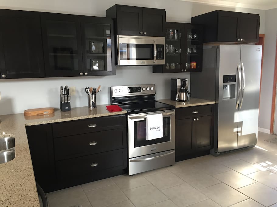 Kitchen equipped with brand new stainless steel appliances