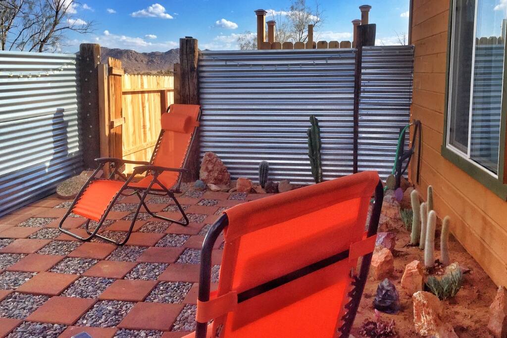 Another look at the side patio with a view of the mountains and door to the back yard. Great spot to relax.