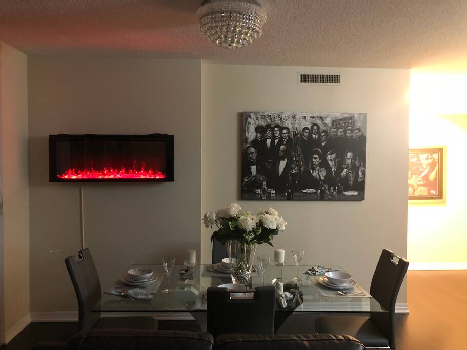 Multiple Color fire place..To set the right mood.Or use the chandelier as a bonus feature Dinner is important have it in style.