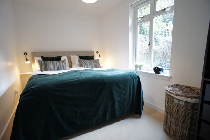 Double bedroom with a king-size bed with separate duvets, quality bed linen and towels provided