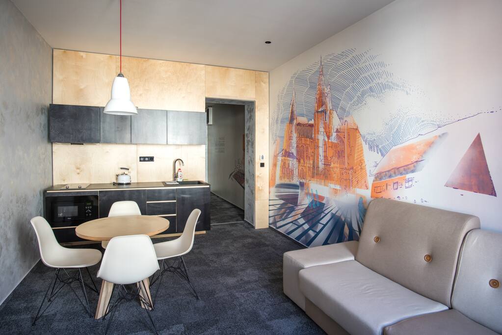 Common room with sofa bed and kitchen