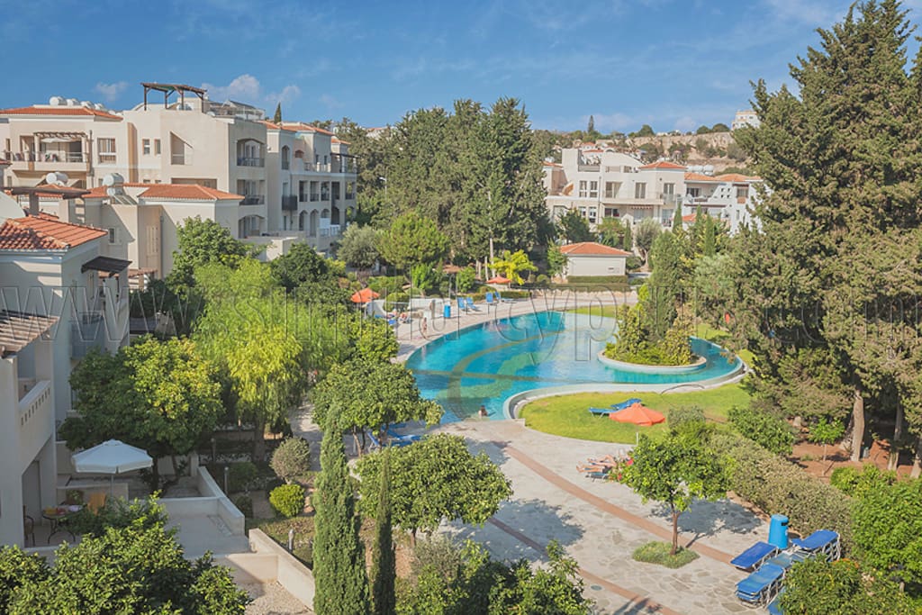 Pool and garden in the complex. This is view of complex pool, not view from apt